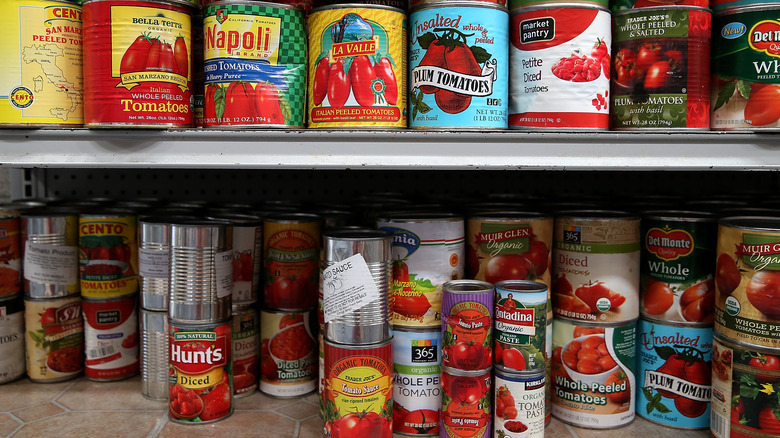 Canned tomatoes on shelves