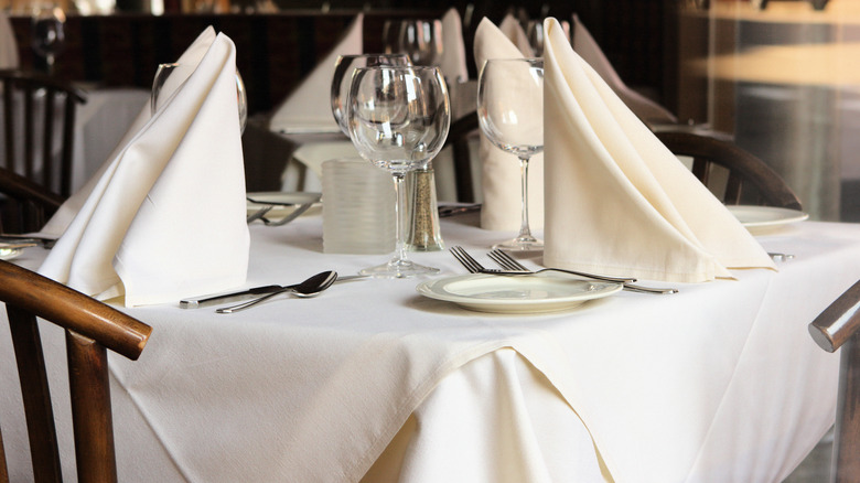 Place settings with folded cloth napkins