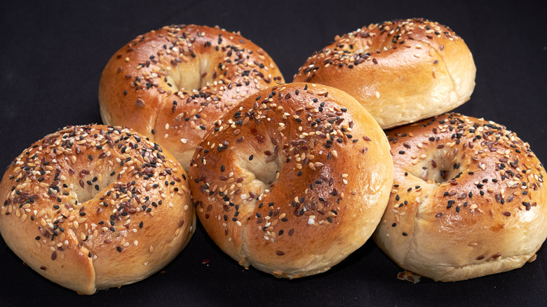 A grouping of poppyseed bagles