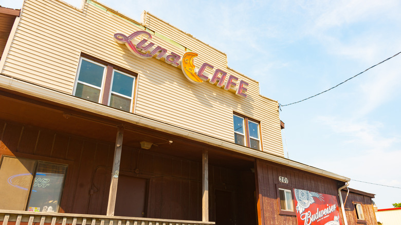 The exterior of Luna Cafe with the front sign and entrance