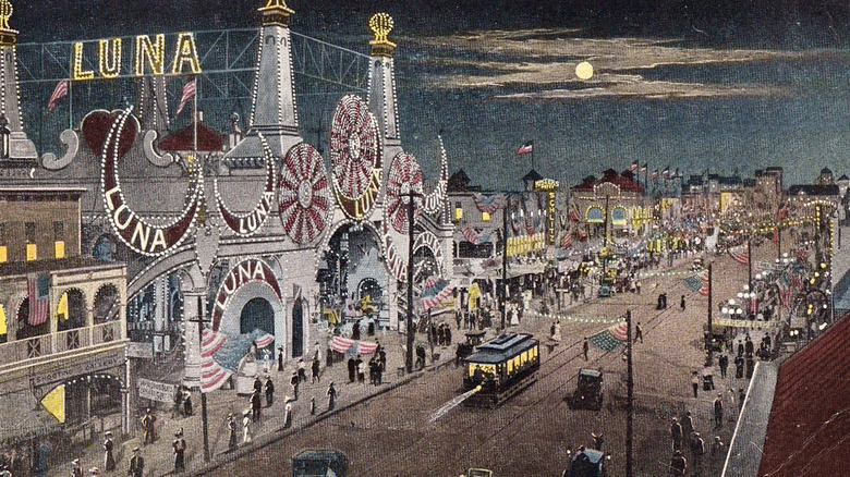 A vintage postcard from 1918 showing Coney Island with lights and amusement parks