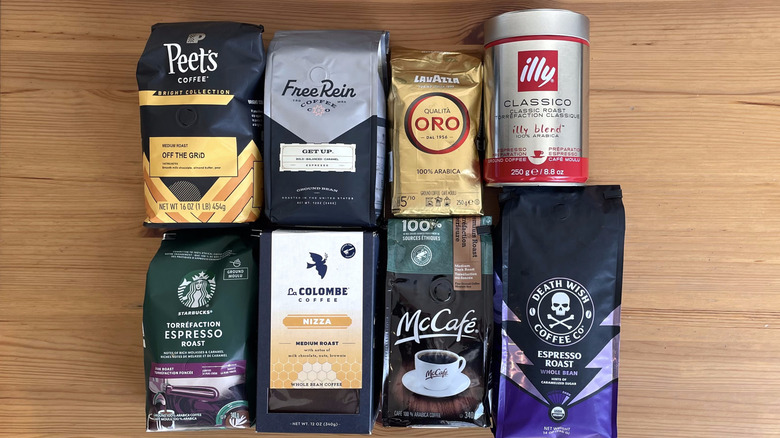 8 bags of coffee displayed on wooden surface