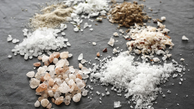 Small piles of different salt crystals in a ring