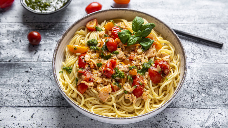 Spaghetti with salmon, tomatoes, and basil