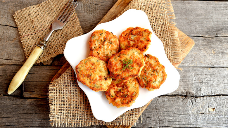 A plate of fish patties and fork