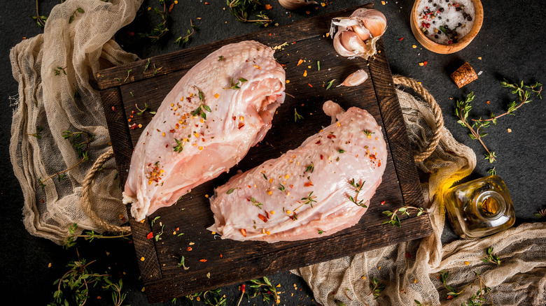 seasoned chicken breast on board