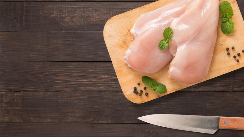 raw chicken and knife