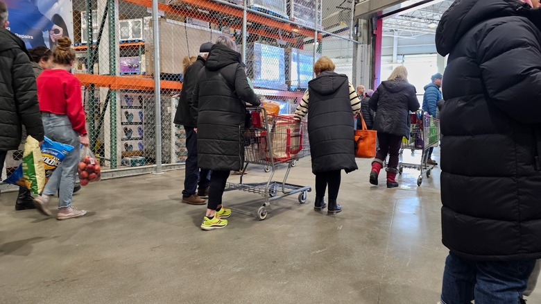 Customers making their way through a crowded Costco exit