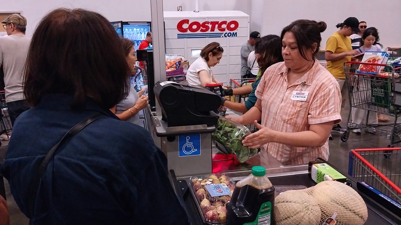 Costco cashier checking out a customer