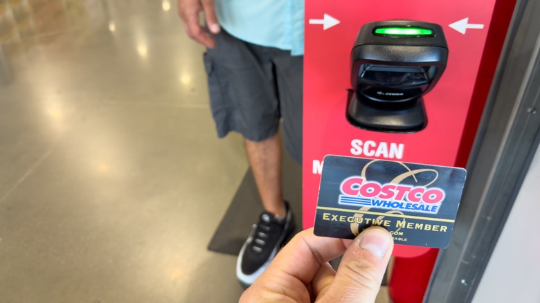 Person scanning their membership card