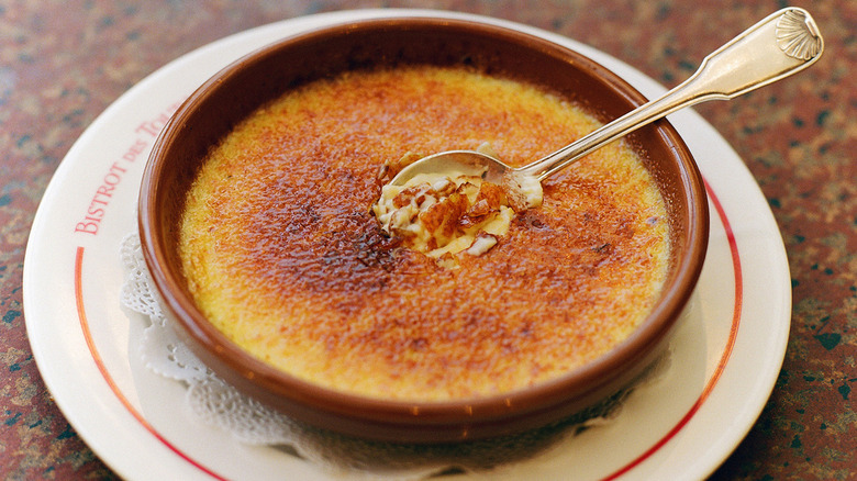 Crème brûlée in bowl with spoon