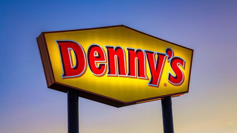 A lit-up Denny's sign