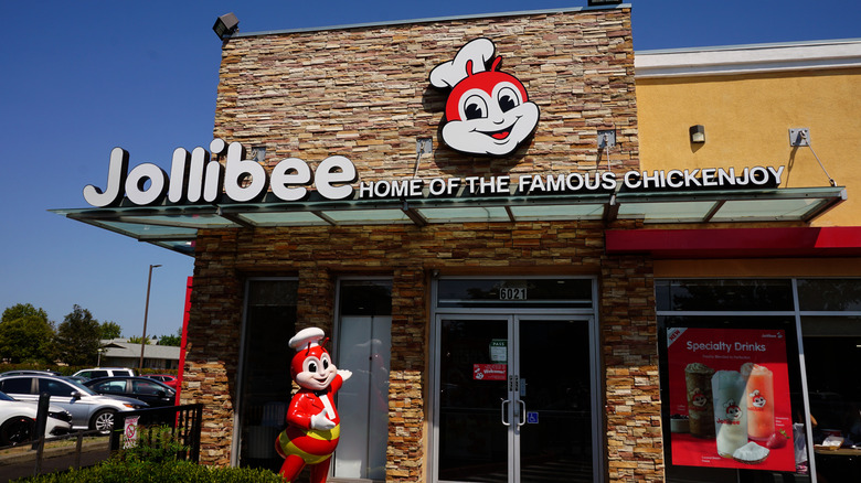 Exterior of a Jollibee restaurant with mascot