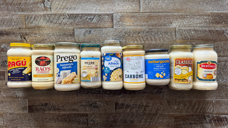 Alfredo pasta sauces on wooden surface
