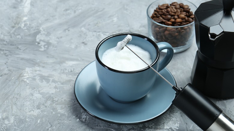 Milk frother and cup