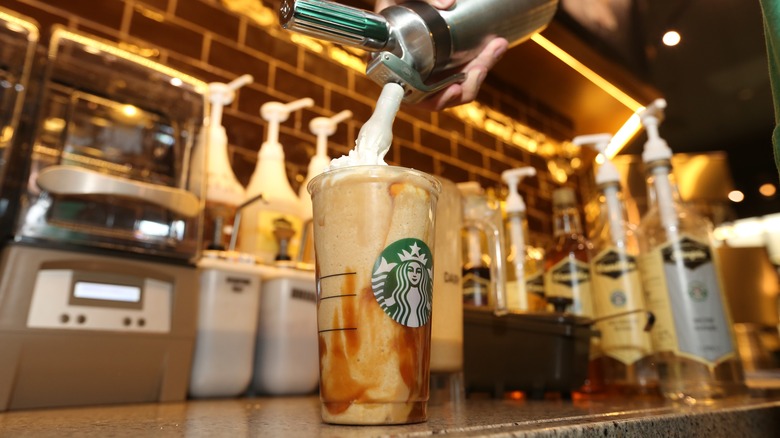 Starbucks barista making a drink