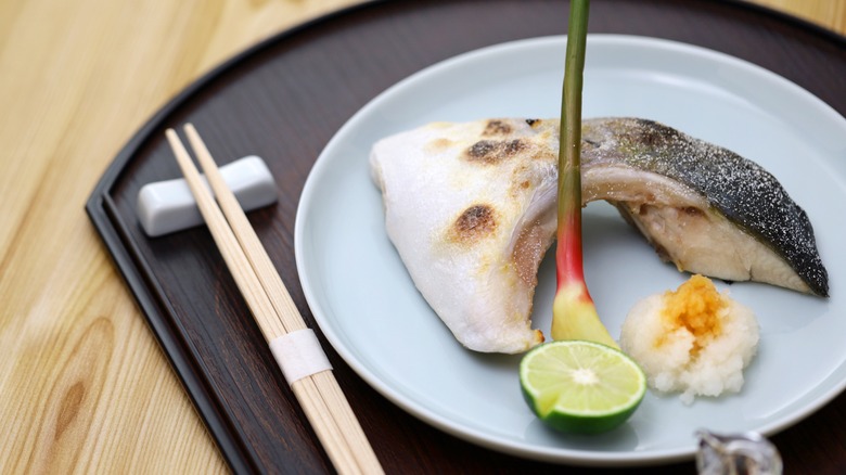 Grilled yellowtail collar on plate