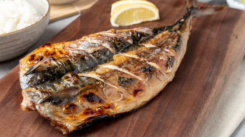 Grilled mackerel on wooden tray