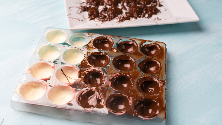 Chocolate molds with melted chocolate