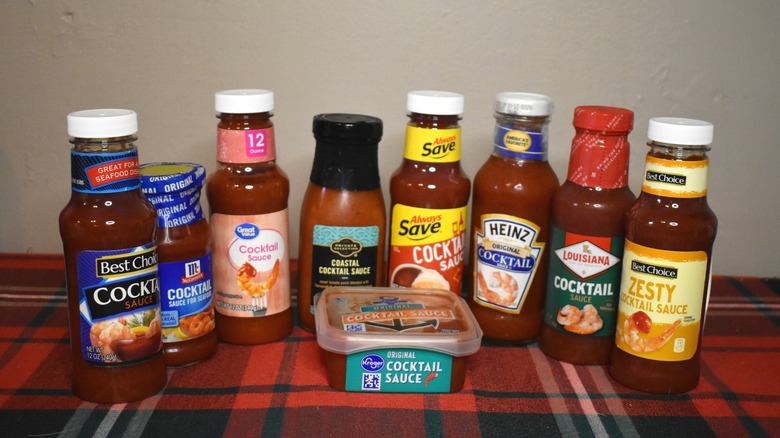 9 cocktail sauce bottles in a semicirle