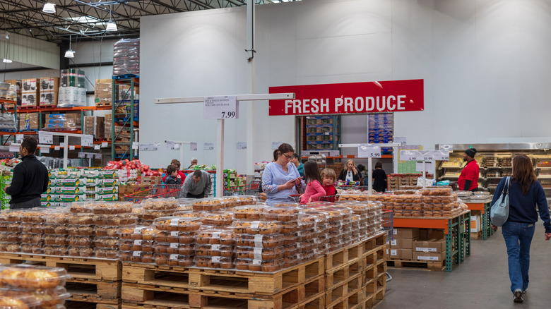 People shopping in the baked goods section at Costco