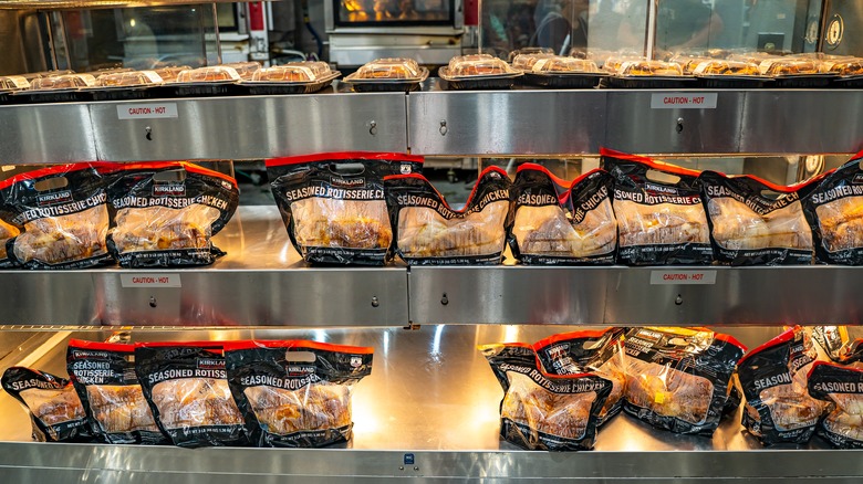 Costco deli shelves with rotisserie chicken