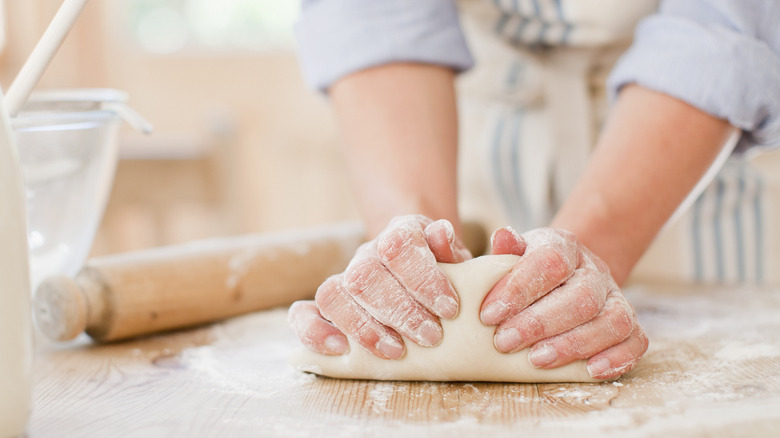 Person kneading dough