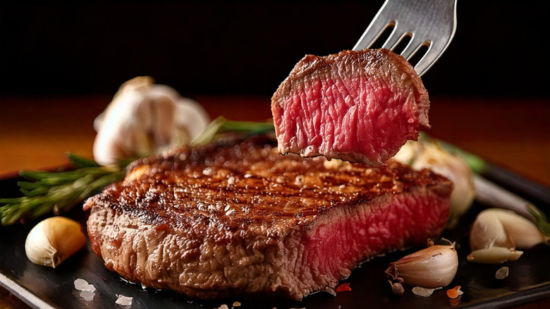 Piece of steak on a fork