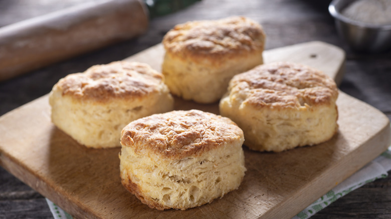 Flaky biscuits on cutting board