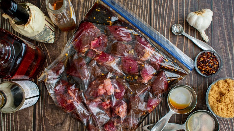 Steak marinating in a bag of honey, sauce, and spices