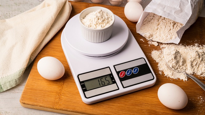 weighing flour on scale