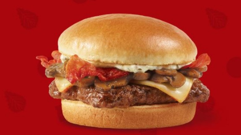 A Mushroom Bacon Cheeseburger from Wendy's is displayed.