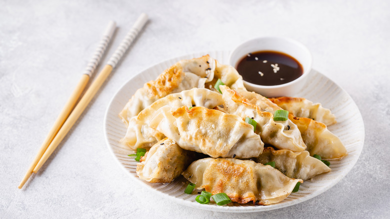 Fried jiaozi with a dipping sauce