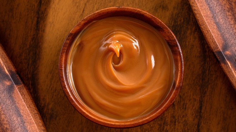 Wooden bowl of dulce de leche