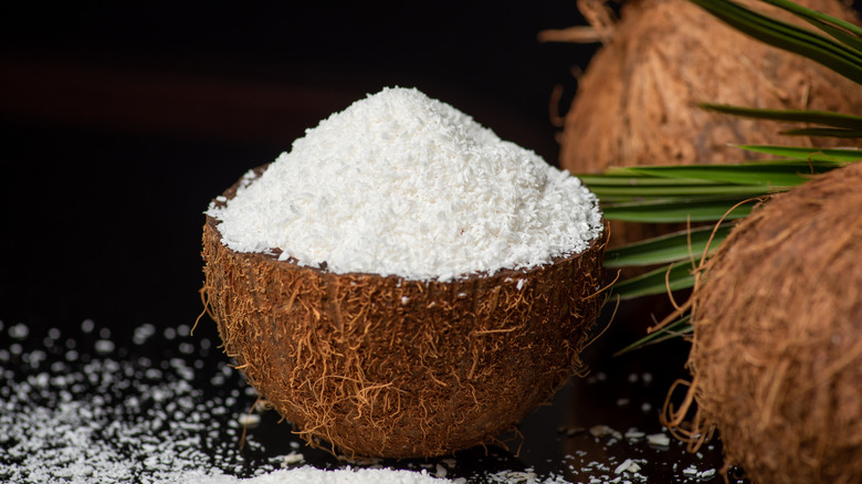 Shredded coconut in a coconut shell