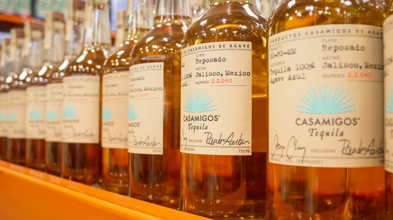 Bottles of Casamigos Reposado tequila on a store shelf