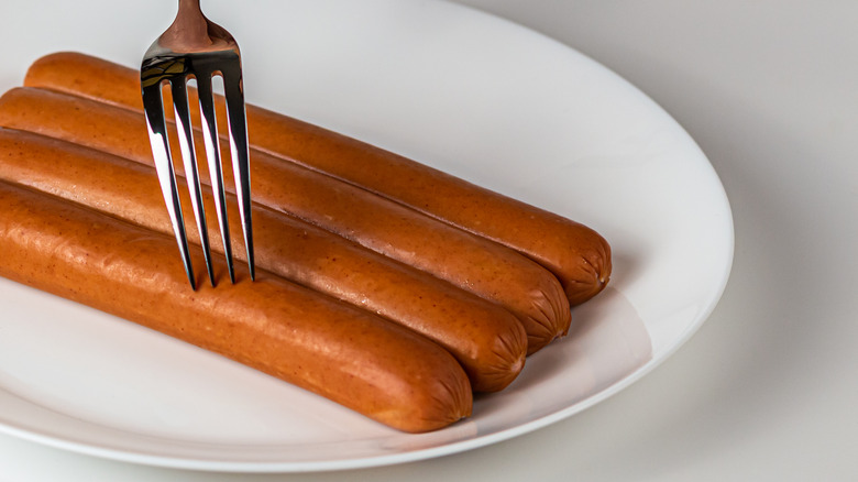 Four hot dogs on plate