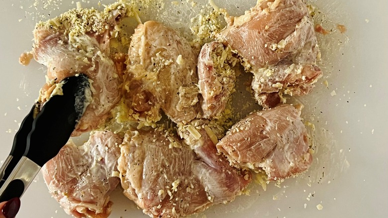 flipping chicken thighs with breading