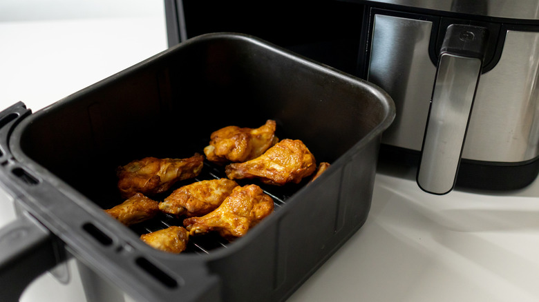 chicken wings loaded into air fryer