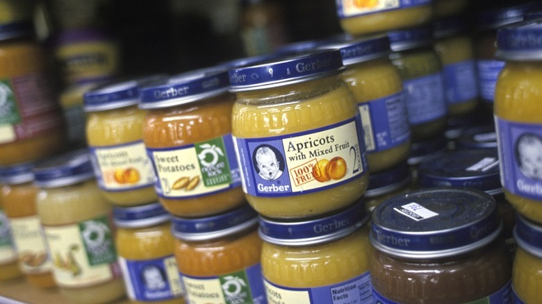 Jars of baby food on store shelf