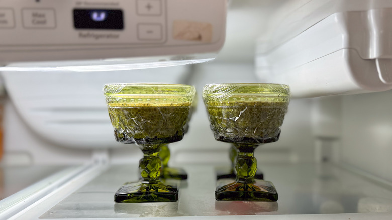 Chai chia pudding in covered serving dishes in refrigerator