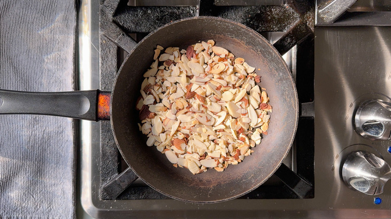 Slivered almonds in skillet on stovetop