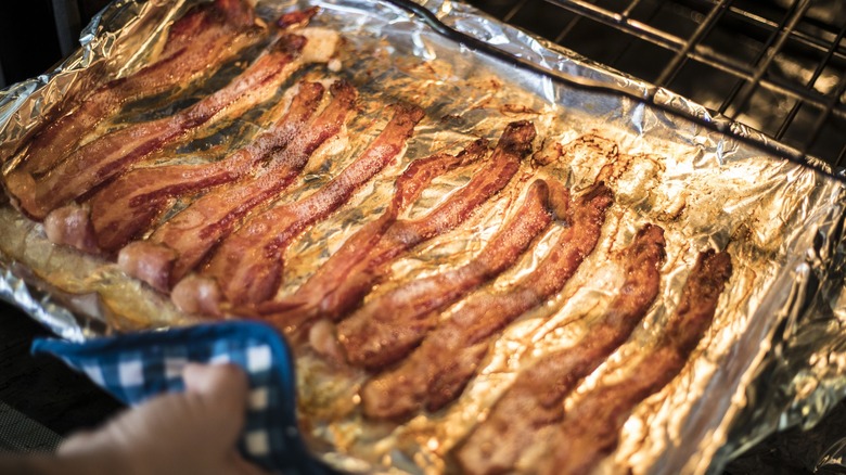 Bacon strips on a baking sheet