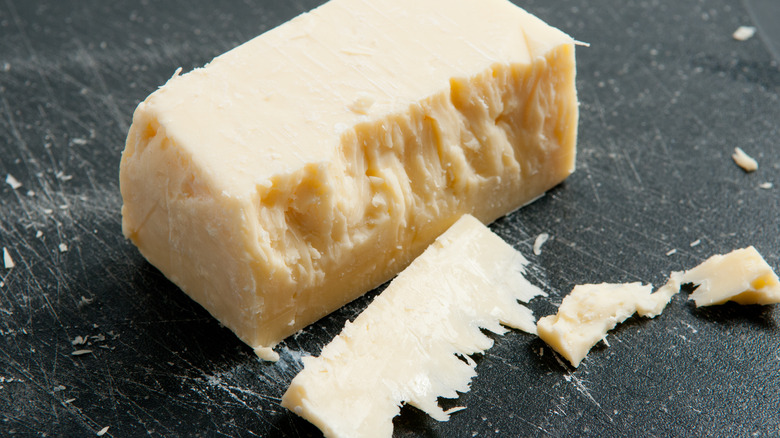 block of aged white cheddar cheese