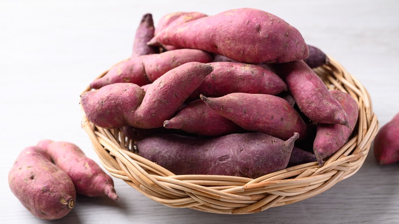 Sweet potatoes in basket on counter