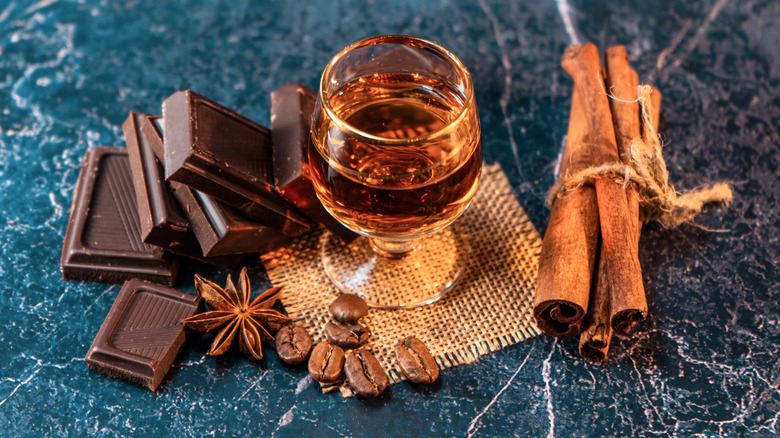 Glass of bourbon with chocolate and spices