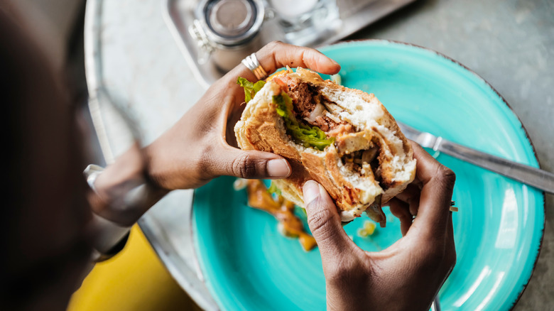 diner eating a vegan burger