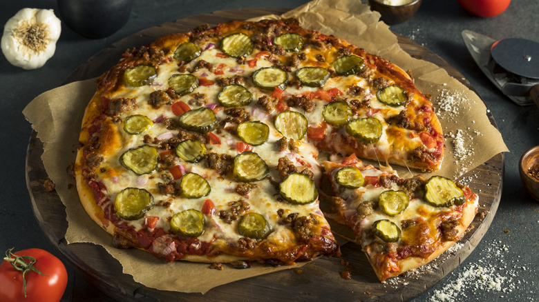 Pizza with pickle slices on top