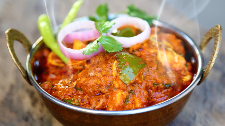 Paneer curry in a metal bowl