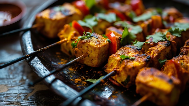 Grilled paneer kebabs on skewers